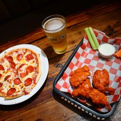 High Noon Saloon & Kitchen - The ultimate crowd-pleaser: hot pizza, saucy wings, and an ice-cold beer.  Game night, date night, or every night - this trio always wins.