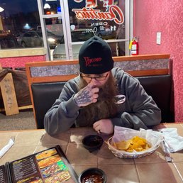 Chips, salsa, and my fella apparently picking his nose.. Chips, salsa, and my fella apparently picking his nose..