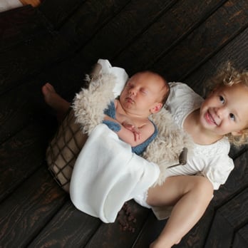 Lynsie Rae Photography - A 2 year old sitting and smiling, simply amazing! - Session Photography Near Me