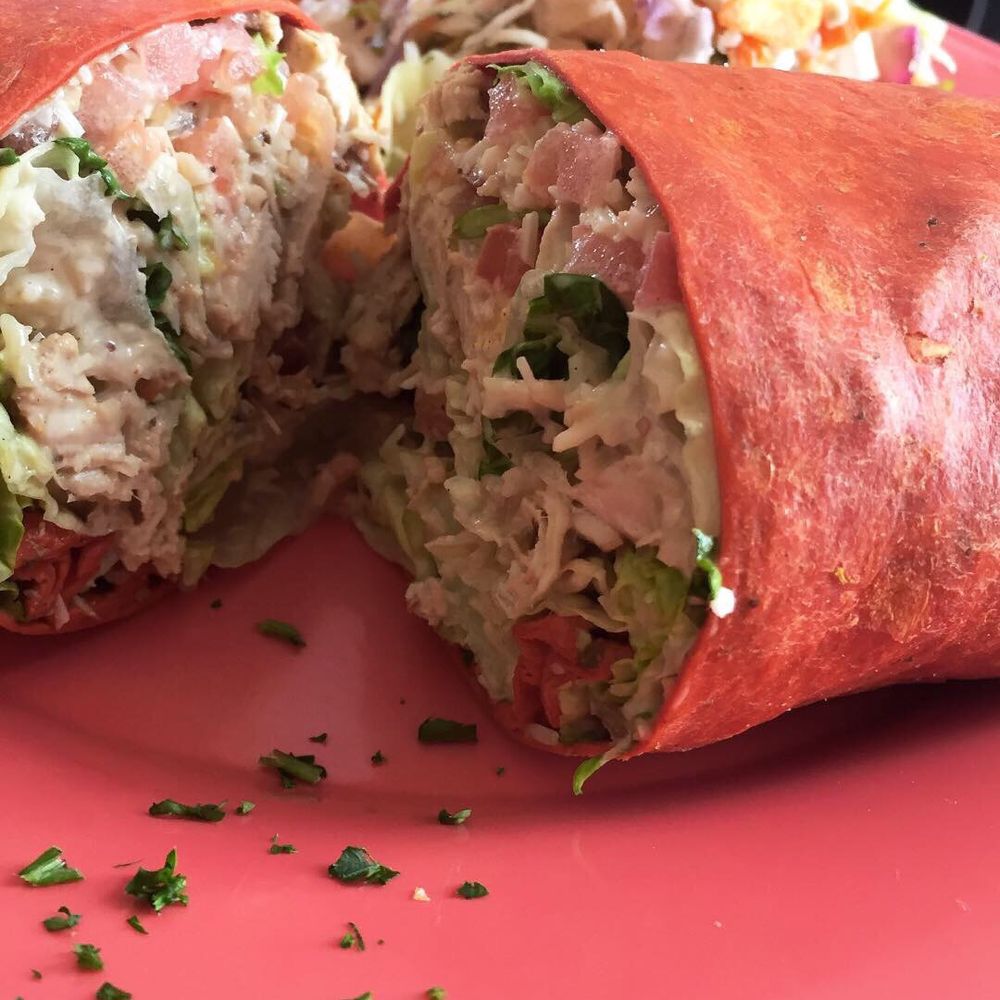 Back 40 Urban Cafe - The jerk chicken Caesar wrap (big enough to fill you up!). - Caribbean Near Me - St. Augustine, Florida Back 40 Urban Cafe - The jerk chicken Caesar wrap (big enough to fill you up!). - Caribbean Near Me - St. Augustine, Florida