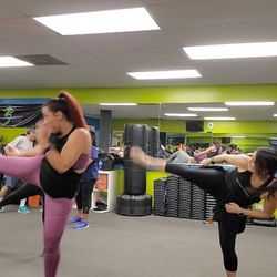 The Cardio Grind Fitness Experience - Intense Kickboxing classes daily!