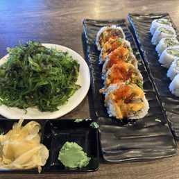 Huge portion of seaweed salad, sumo roll, and cucumber roll Huge portion of seaweed salad, sumo roll, and cucumber roll