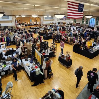 Chicago Plumbers Union Hall - An indoor market with multiple vendor booths displaying clothing, jewelry, and crafts, with shoppers browsing and shopping. - Venues & Event Spaces Near Me - Chicago, Illinois