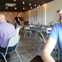 Froth & Fodder - Decor is minimalistic, concrete and metal chairs, but with nice touches like the lights hanging from ceiling and couches.