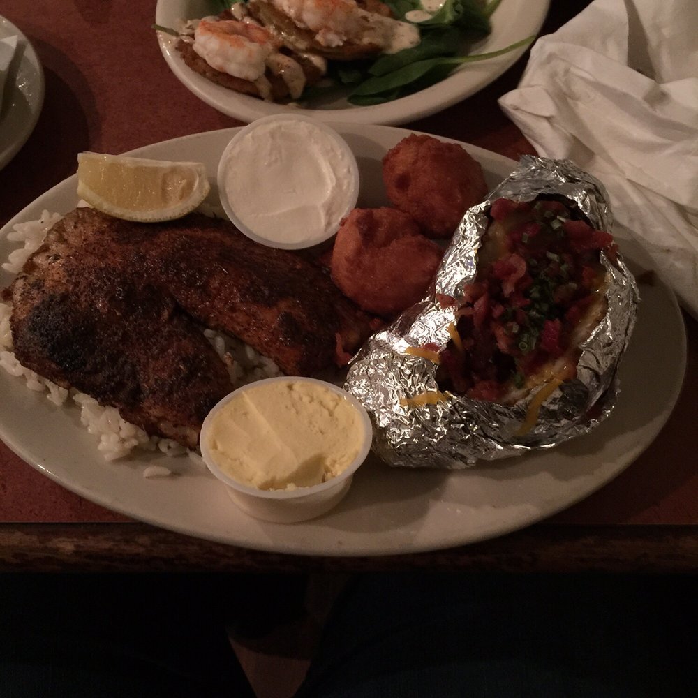 Jim Shaw's Restaurant - Blackened tilapia (too salty) on a bed of rice, loaded baked potato (ok/good) - Seafood Near Me - Macon, Georgia Jim Shaw's Restaurant - Blackened tilapia (too salty) on a bed of rice, loaded baked potato (ok/good) - Seafood Near Me - Macon, Georgia
