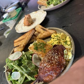 Herbst Eatery & Farm Stand - Duck confit, so good!! Scone and scrambled eggs topped with shredded duck. - Wine Bars Near Me - Saint Paul, Minnesota Herbst Eatery & Farm Stand - Duck confit, so good!! Scone and scrambled eggs topped with shredded duck. - Wine Bars Near Me - Saint Paul, Minnesota