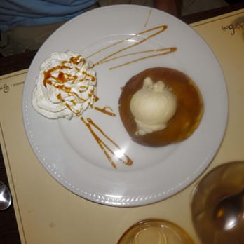 Au Feu de Bois - Tarte tatin avec sa boule de glace vanille is an apple tart topped with vanilla ice cream.  Dessert offered on formula menu. - Barbeque Near Me - Sète, 34