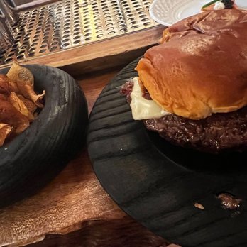 Coquette - a burger and potato chips on a plate - French Near Me - Chicago, Illinois
