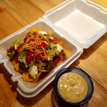 Snack Shack - Beef Nachos with lettuce, tomatoes, jalapenos, cheddar cheese & side of Queso - Desserts Near Me - Alpine, Texas Snack Shack - Beef Nachos with lettuce, tomatoes, jalapenos, cheddar cheese & side of Queso - Desserts Near Me - Alpine, Texas