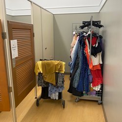 Kohl's - Full racks and carts of items to be put away. It's like no one is working.