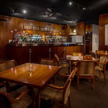 The Mark Olympia - a restaurant with wooden tables and chairs - Lounges Near Me - Olympia, Washington The Mark Olympia - a restaurant with wooden tables and chairs - Lounges Near Me - Olympia, Washington