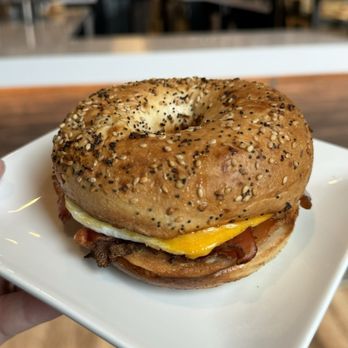 Sweetwaters Coffee & Tea - Bagel Sandwich - Bacon, Egg & Cheese - Coffee & Tea Near Me - Grand Forks, North Dakota Sweetwaters Coffee & Tea - Bagel Sandwich - Bacon, Egg & Cheese - Coffee & Tea Near Me - Grand Forks, North Dakota