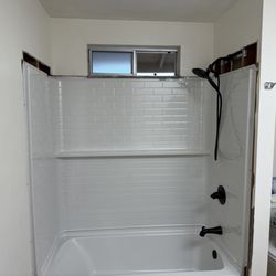 Desert Dynamic Plumbing - Bathtub, shower valve, and fiberglass wall installation