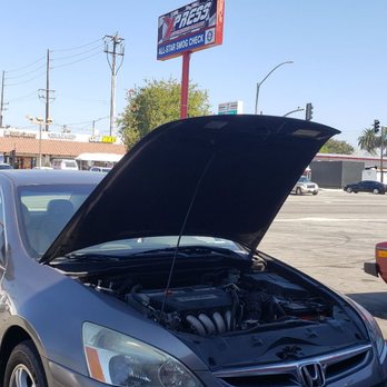 All Star Smog - Car being serviced at All-Star Smog Check. - Smog Check Stations Near Me - Long Beach, California All Star Smog - Car being serviced at All-Star Smog Check. - Smog Check Stations Near Me - Long Beach, California
