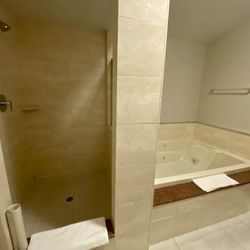 Jasper Inn & Suites - King suite mountain view - huge bathroom with 2 person shower, 2 person jacuzzi tub, and 2 sinks.