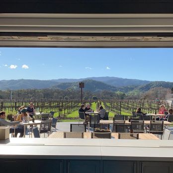 Goosecross Cellars - Views from inside tasting room bar looking out at their patio - Wineries Near Me - Yountville, California