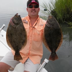 Capt. Jot with two very nice Wrightsville Beach Flounder caught on one of his fishing charters.