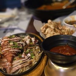 Squid, sweet and sour pork, and seafood stew