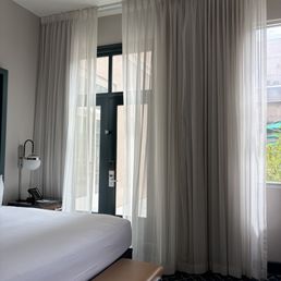 Interior 2nd floor room featuring door to courtyard pool