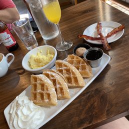 Belgian waffles, scrambled eggs, bacon, mimosa