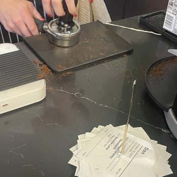 Godega Market - Hand tamping their coffee. - Coffee & Tea Near Me - Omaha, Nebraska