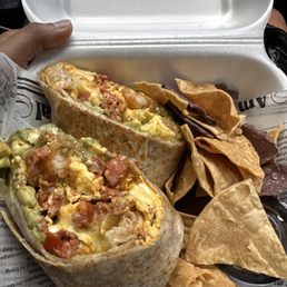 Brunch burrito with side of chips Brunch burrito with side of chips