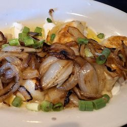Joe's Oasis - Pierogi swimming in butter and smothered in onions.