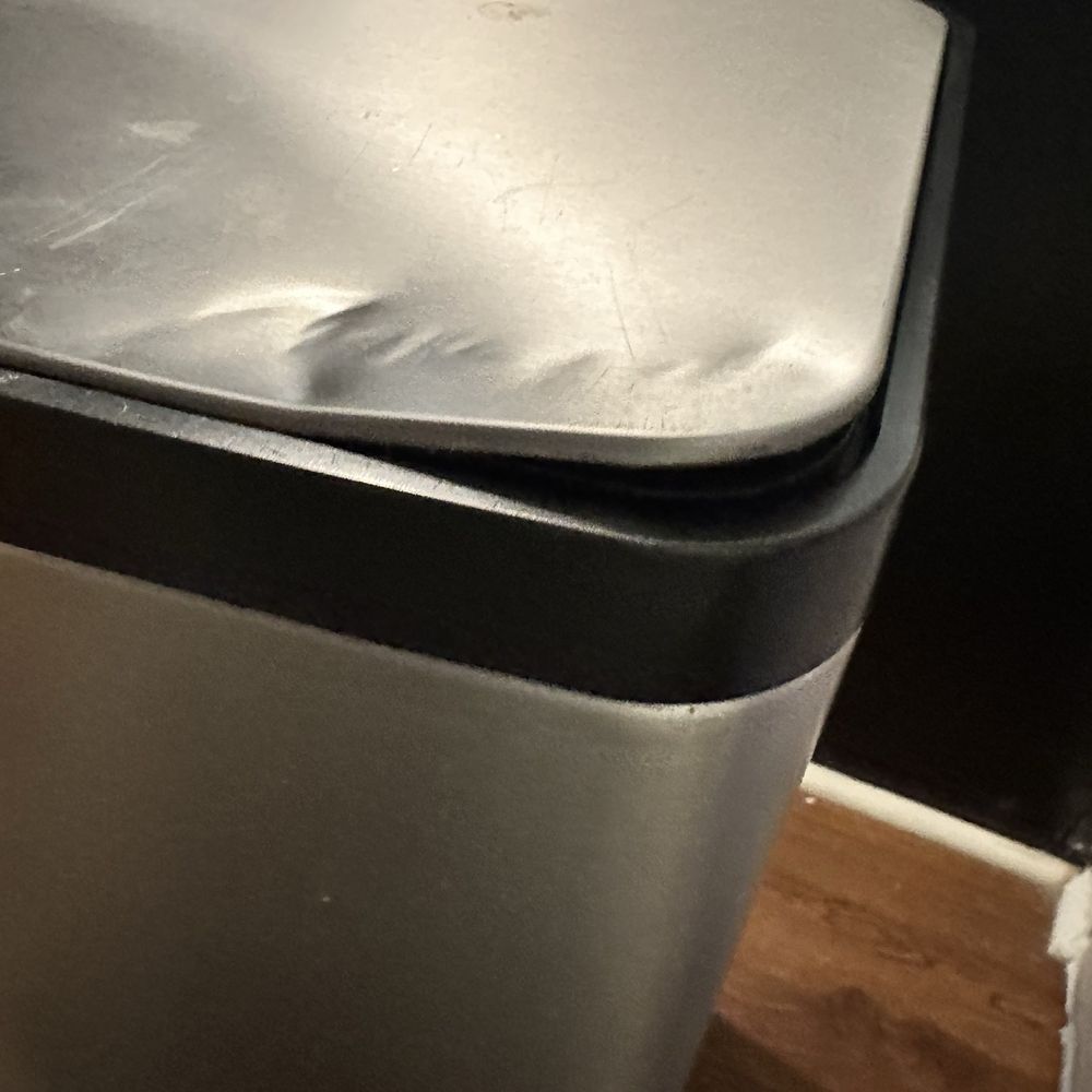 Caniff Solutions - Damaged trashcan lid - Movers Near Me Caniff Solutions - Damaged trashcan lid - Movers Near Me