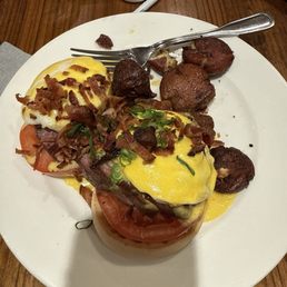 STEAK BENEDICT 4oz grilled beef tenderloin, bacon, two basted eggs, toasted English muffin, sliced tomato, hollandaise, home fries STEAK BENEDICT 4oz grilled beef tenderloin, bacon, two basted eggs, toasted English muffin, sliced tomato, hollandaise, home fries