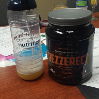 Supplement Warehouse - a bottle of protein and a bottle of water on a desk - Weight Loss Centers Near Me - Austin, Texas