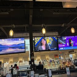 Laura's Bar And Grill - Interior bar shot - big area lots of TVs