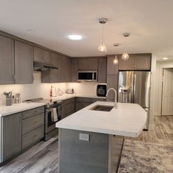Nevada Western Construction - After: Kitchen is where brick fireplace and built in desk were.