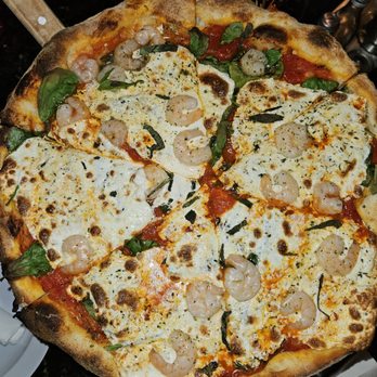 Colarusso's Coal-Fired Pizza - a pizza on a pizza stone - Pizza Near Me - Dickson City, Pennsylvania Colarusso's Coal-Fired Pizza - a pizza on a pizza stone - Pizza Near Me - Dickson City, Pennsylvania