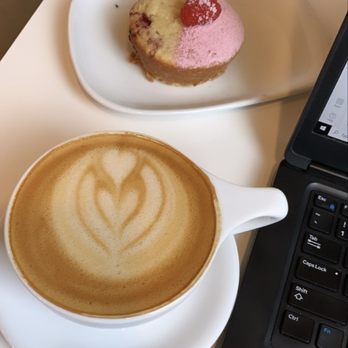 Sweet Bloom Coffee Roasters - Spicy chai team latte and raspberry coffee cake - Coffee & Tea Near Me - Arvada, Colorado