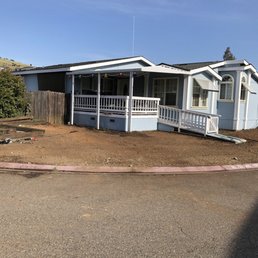 Took down 2 well established tree, shrubs and sod  to ready for a new landscape.