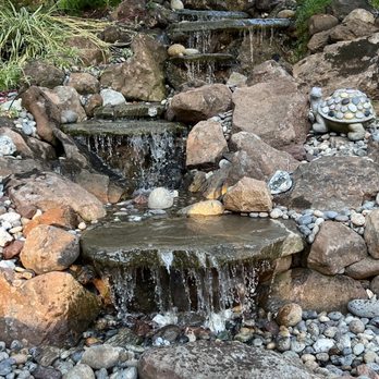 Pond Magic - a waterfall flowing over rocks - Landscaping Near Me - Santa Cruz, California Pond Magic - a waterfall flowing over rocks - Landscaping Near Me - Santa Cruz, California