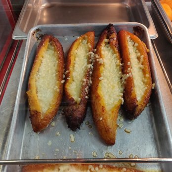 Las Americas Bakery - What caught my eye; plantain con queso. A plantain split down the middle and filled with melted cheese. $3.50 each as of 15 October 2021. - Bakeries Near Me - Elmhurst, New York