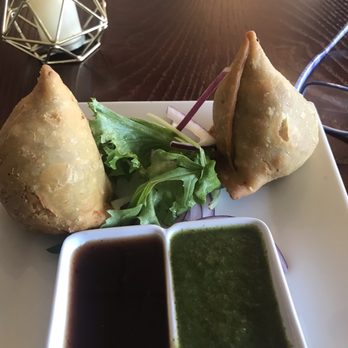Saffron - South - Potato and pea samosa. The green sauce is the best, so flavorful. - Indian Near Me - Austin, Texas Saffron - South - Potato and pea samosa. The green sauce is the best, so flavorful. - Indian Near Me - Austin, Texas