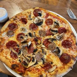 Bellissima Italian Mediterranean Restaurant - Build Your Own pizza. Pizzas are 50% off every day from 2-5pm. If you add extra toppings, the toppings aren't 1/2 off though.