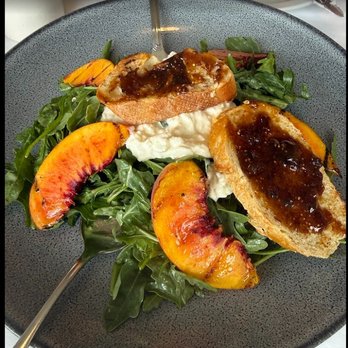 La Cote Bleue - Peach salad with burrata,  fig toast and arugula - Modern European Near Me - Pacific Grove, California