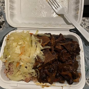 Sweet Spice - a container of meat and cabbage with a fork - Caribbean Near Me - New Rochelle, New York Sweet Spice - a container of meat and cabbage with a fork - Caribbean Near Me - New Rochelle, New York