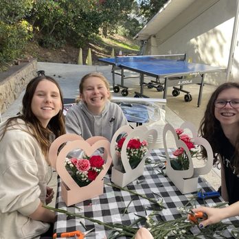 Crown Homeschool Community - Floral design students working on a fresh floral arrangement for Valentine's Day - Educational Services Near Me - Silverado, California Crown Homeschool Community - Floral design students working on a fresh floral arrangement for Valentine's Day - Educational Services Near Me - Silverado, California