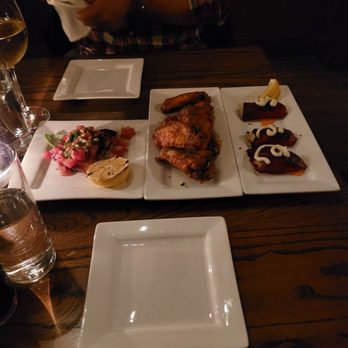 Taberna Tapas - Crab stuffed pequillo peppers,  roasted chicken wings with spicy garlic pimenton sauce, and salmon - Spanish Near Me - Durham, North Carolina