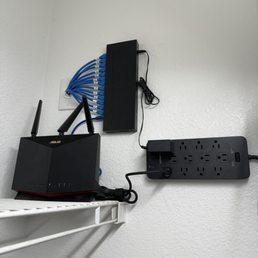 Ethernet switch installed with router and surge protector Ethernet switch installed with router and surge protector