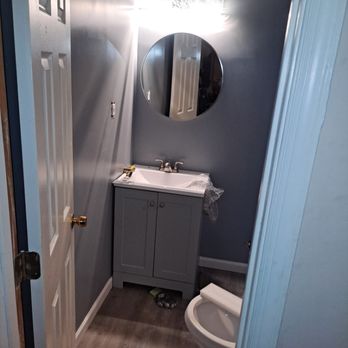 Lastphaze - a bathroom with a sink, toilet, and mirror - Handyman Near Me - Pikesville, Maryland Lastphaze - a bathroom with a sink, toilet, and mirror - Handyman Near Me - Pikesville, Maryland