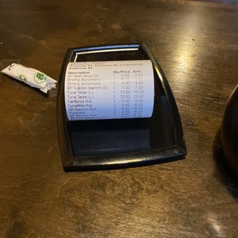 GOGO Sushi - a receipt on a black tray - Sushi Bars Near Me - Lake Country, British Columbia GOGO Sushi - a receipt on a black tray - Sushi Bars Near Me - Lake Country, British Columbia
