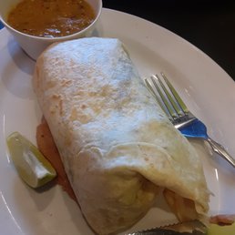 Asada buritto with sauce on the side.