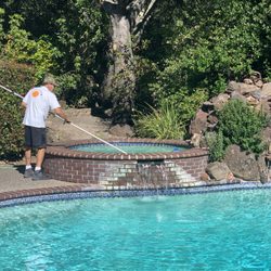 All Seasons Pool Service - Dean cleaning the hot tub.