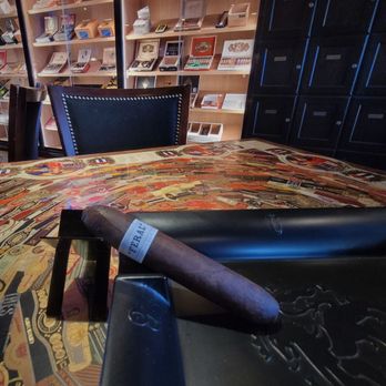 Devon's Pub & Cigars - a cigar on a table - Tobacco Shops Near Me - Denver, Colorado Devon's Pub & Cigars - a cigar on a table - Tobacco Shops Near Me - Denver, Colorado
