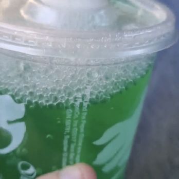 Taco Bell - Soap bubbles and off green Baja Blast. Yum! (This was 2 years ago but their drinks still suck even when not poisoned) - Fast Food Near Me - Fair Oaks, California